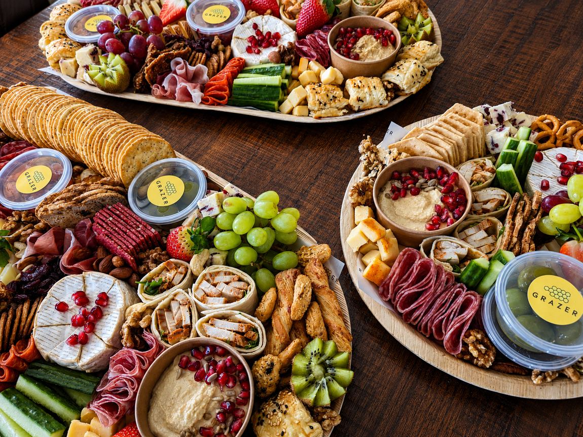 Graze board with cheeses, chutney and seasonal fruit